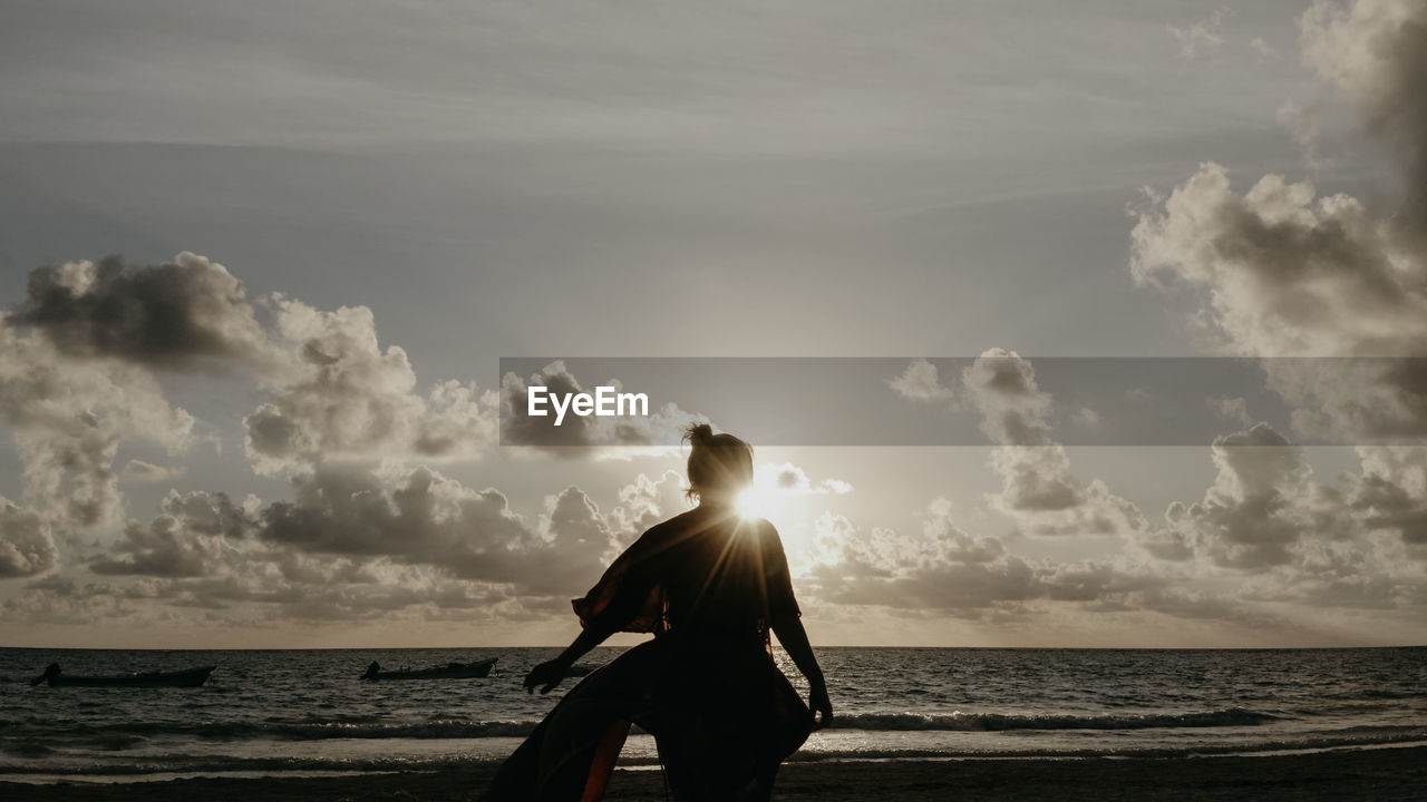 Man looking at sea against sky