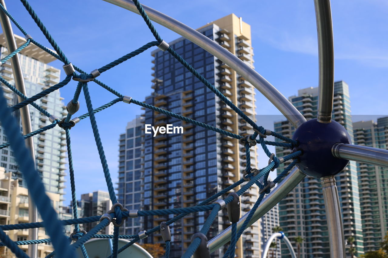 LOW ANGLE VIEW OF BUILDINGS IN CITY AGAINST SKY