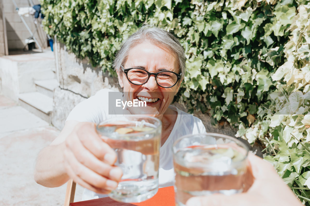 Portrait of smiling woman having drink