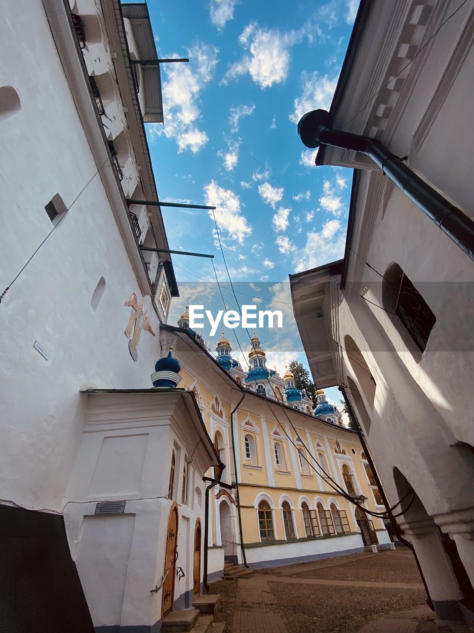 architecture, building exterior, built structure, sky, building, cloud, low angle view, house, city, nature, residential district, window, facade, no people, blue, day, outdoors, sunlight, urban area