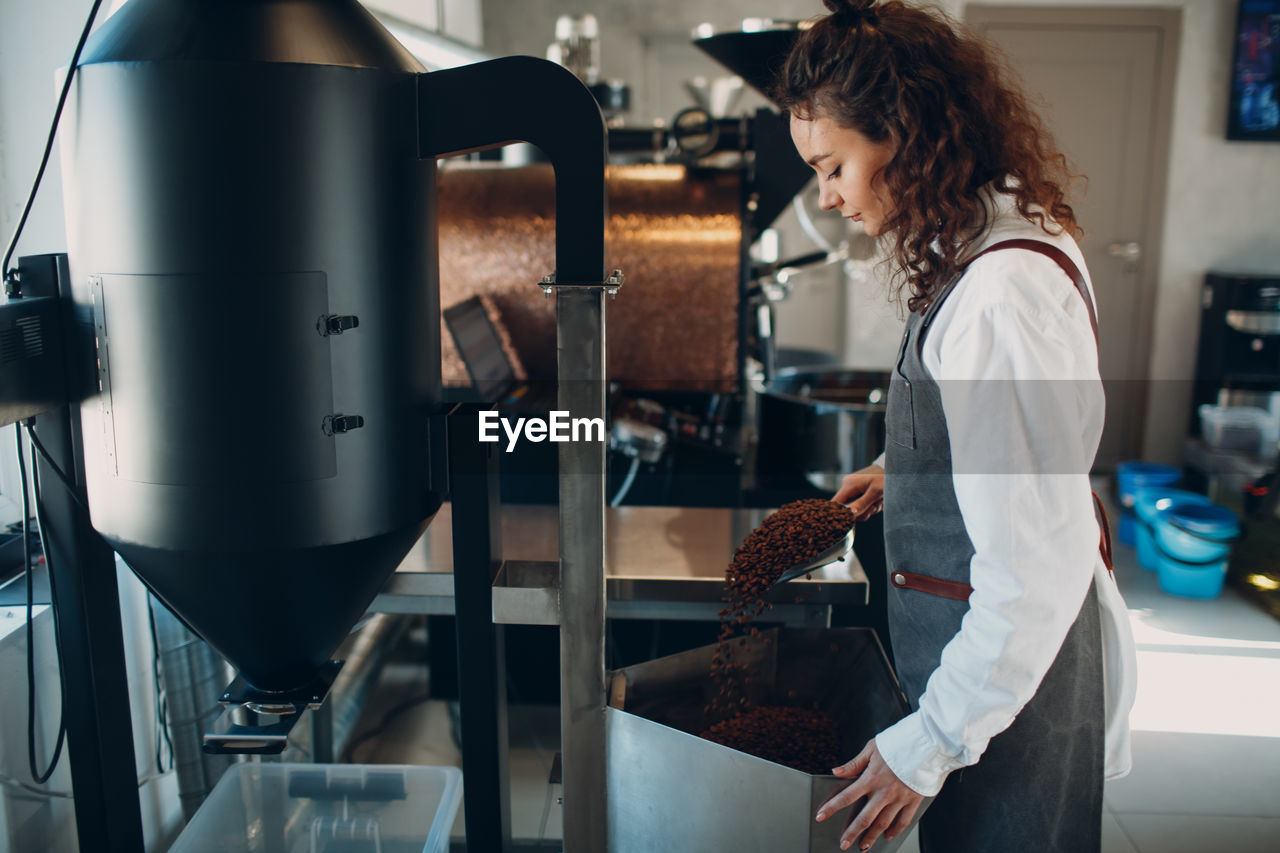 Barista preparing coffee at cafe