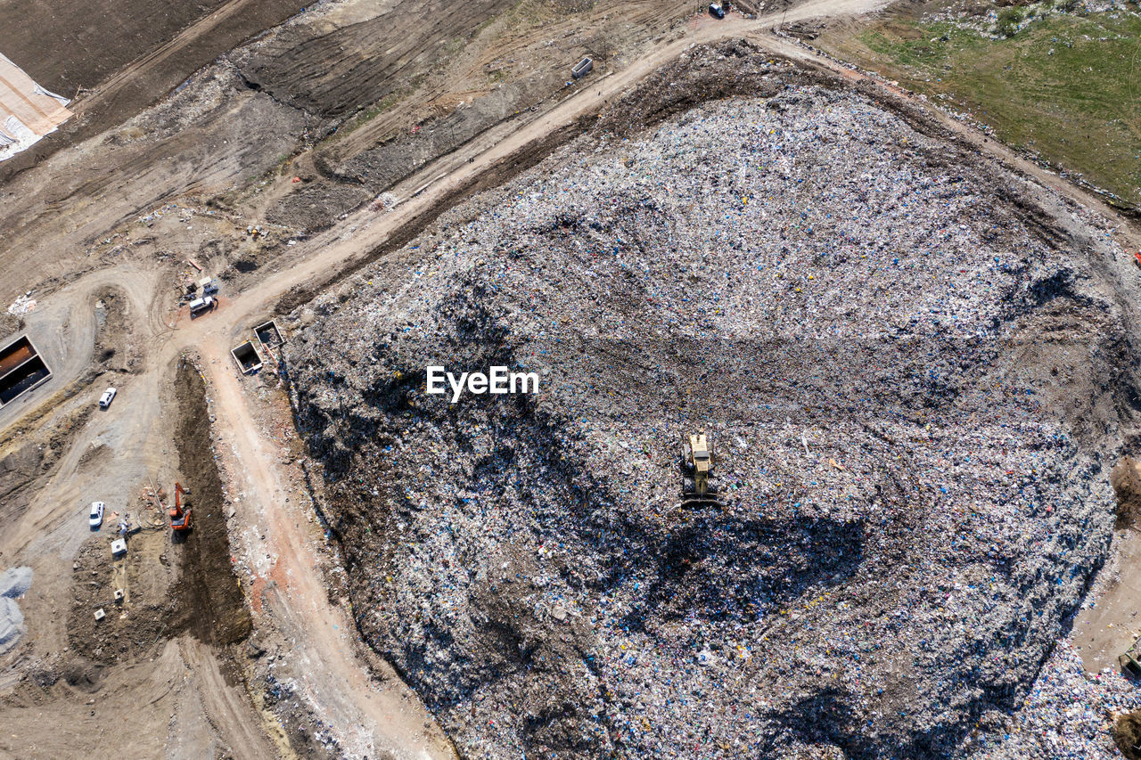 HIGH ANGLE VIEW OF CONSTRUCTION SITE BY LAND