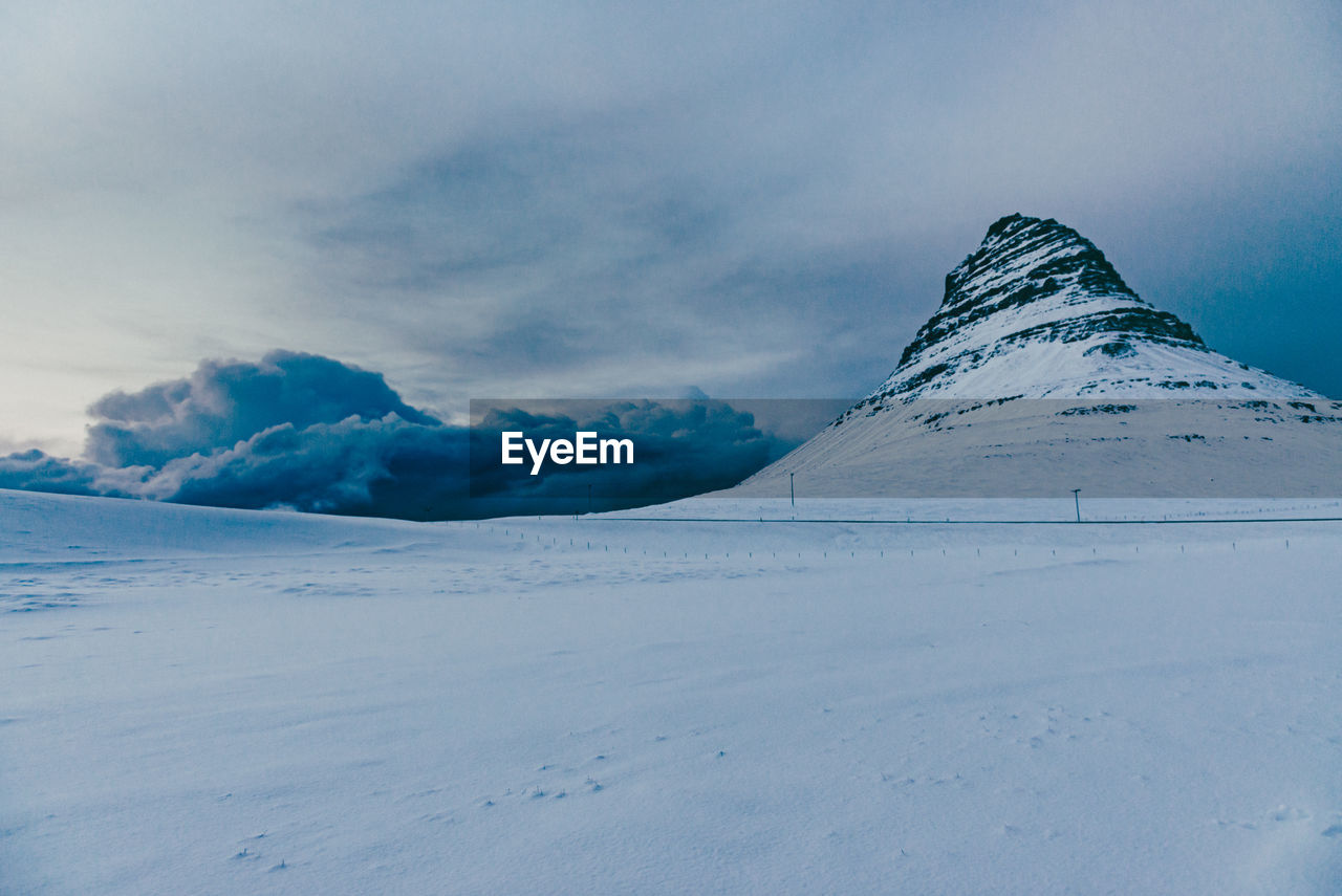 Scenic view of snowcapped mountain against sky