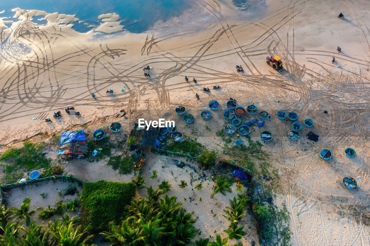 HIGH ANGLE VIEW OF PEOPLE ON THE BEACH