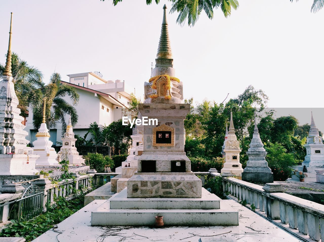 Stupas at pagoda against clear sky