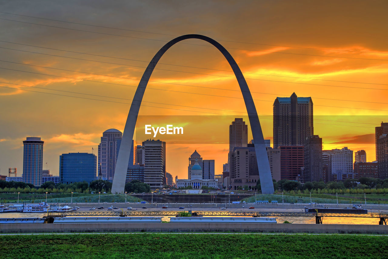 Scenic view of buildings against sky during sunset