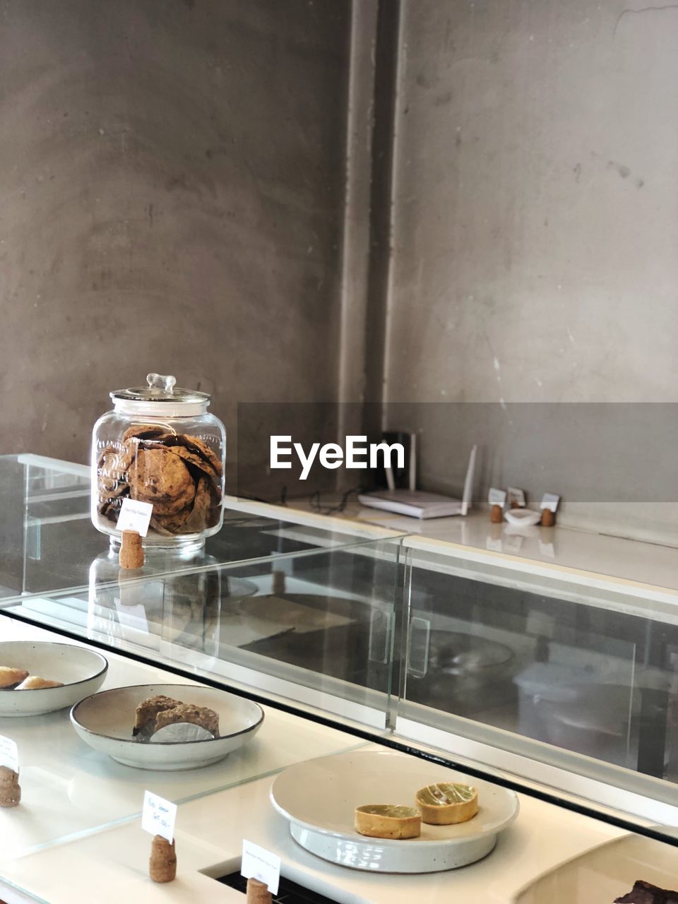 Close-up of cookies jar on glass table