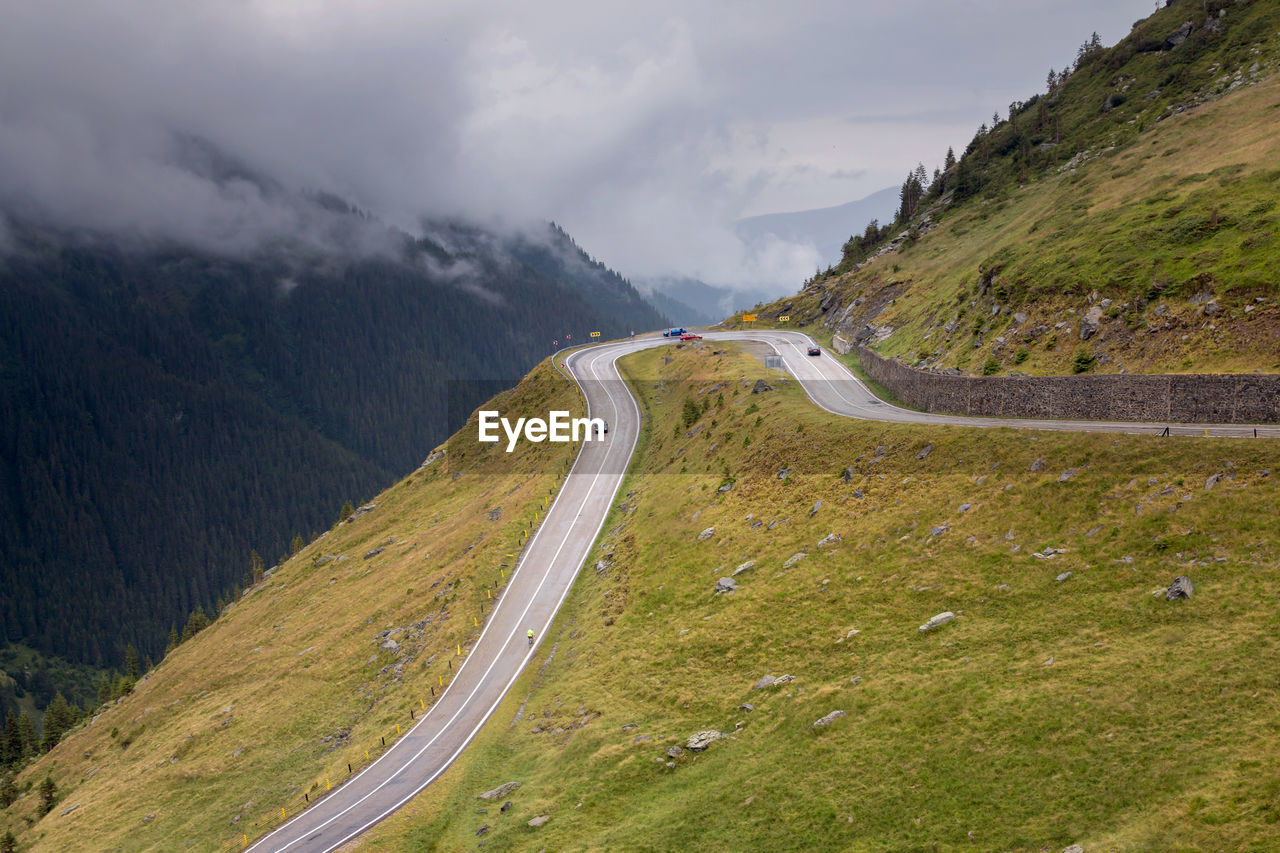 High angle view of road amidst mountains against sky