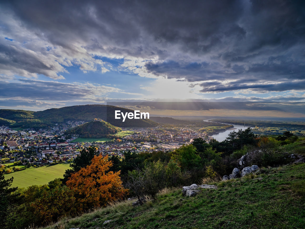 Hainburg city and danube river view from braunsberg mountain in sunset, austria