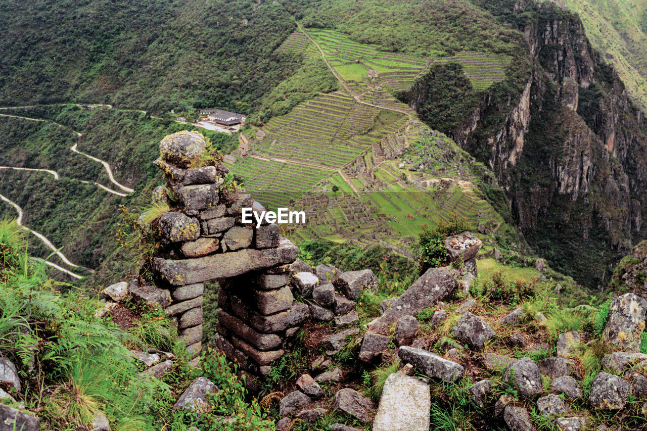 Stone walls ruins and agricultural terraces in the ancient inca city of machu picchu, in peru.