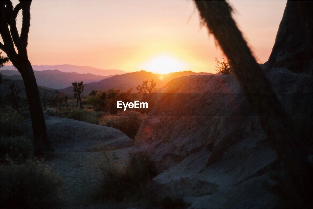 Scenic view of mountains against sky during sunset