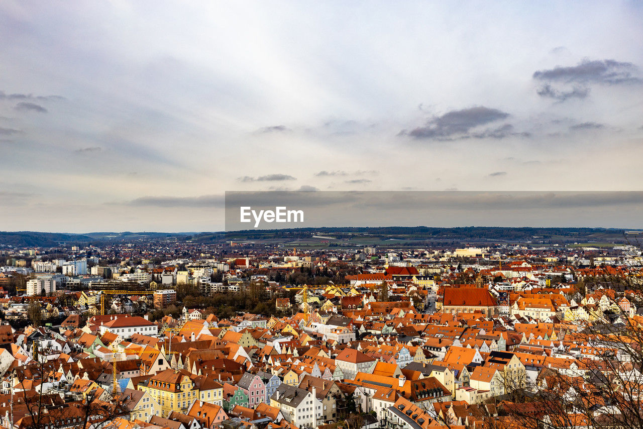 architecture, city, building exterior, built structure, building, cityscape, sky, residential district, horizon, high angle view, nature, cloud, town, travel destinations, crowded, house, skyline, roof, crowd, landscape, travel, environment, evening, urban area, outdoors, community, tourism, urban skyline, land, city life, aerial view, residential area, scenics - nature, dusk, water, sea, sunset, aerial photography, sunlight, day, religion, panoramic, multi colored
