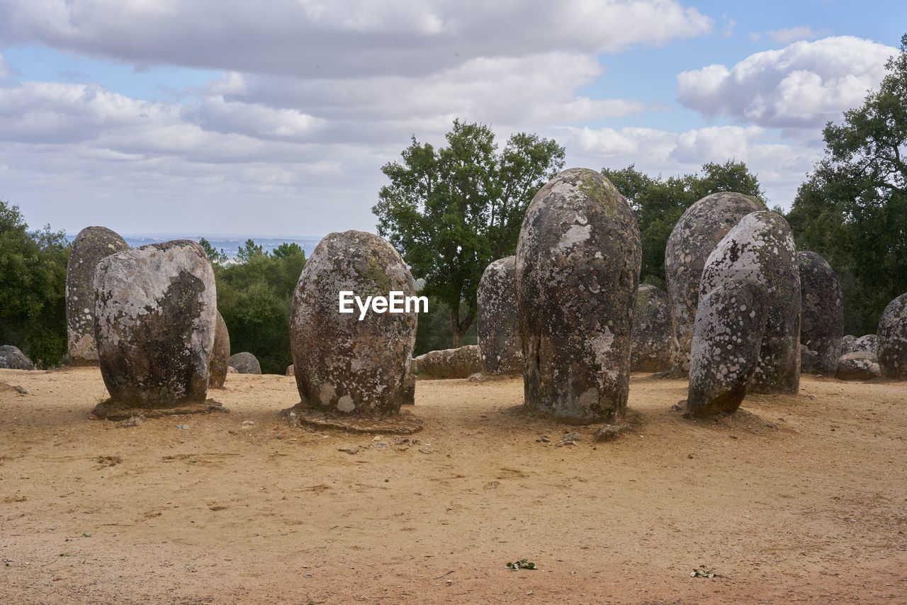 Cromlech of almendres megalithic stone complex with cork trees in alentejo, portugal