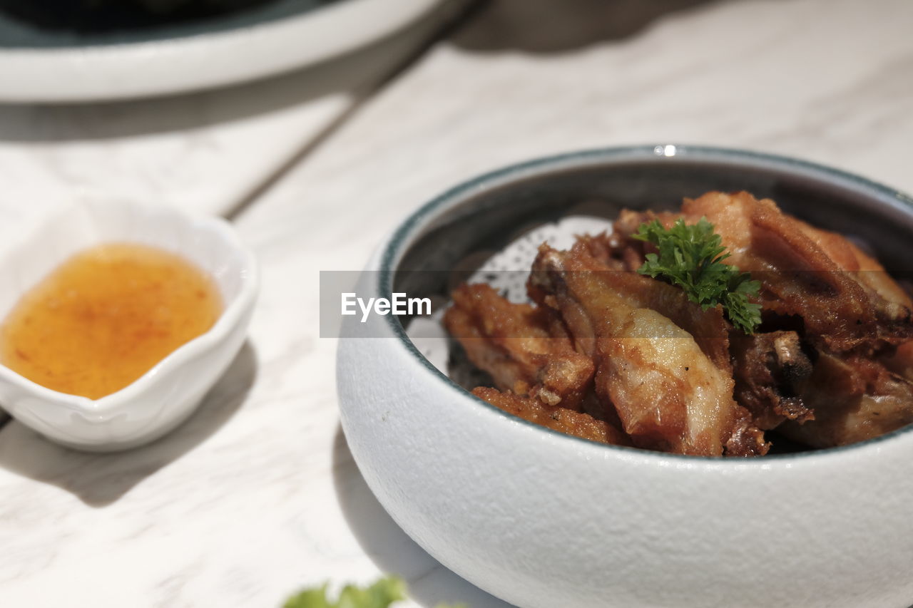 food and drink, food, bowl, healthy eating, meat, wellbeing, freshness, asian food, dish, meal, cuisine, no people, table, plate, vegetable, close-up, indoors, savory food, stew, focus on foreground, herb, dinner, spice, still life, produce, soup, crockery, garnish, gourmet