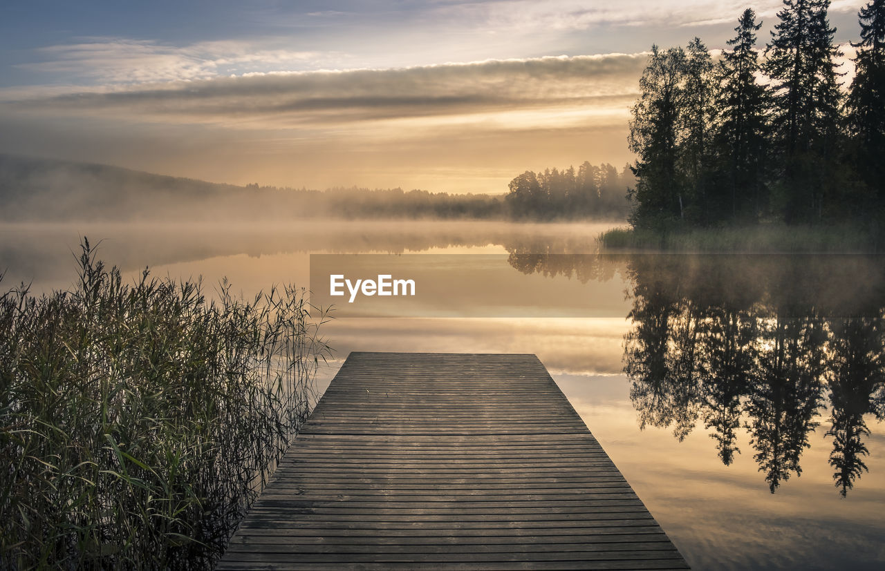 PIER OVER LAKE AGAINST SKY