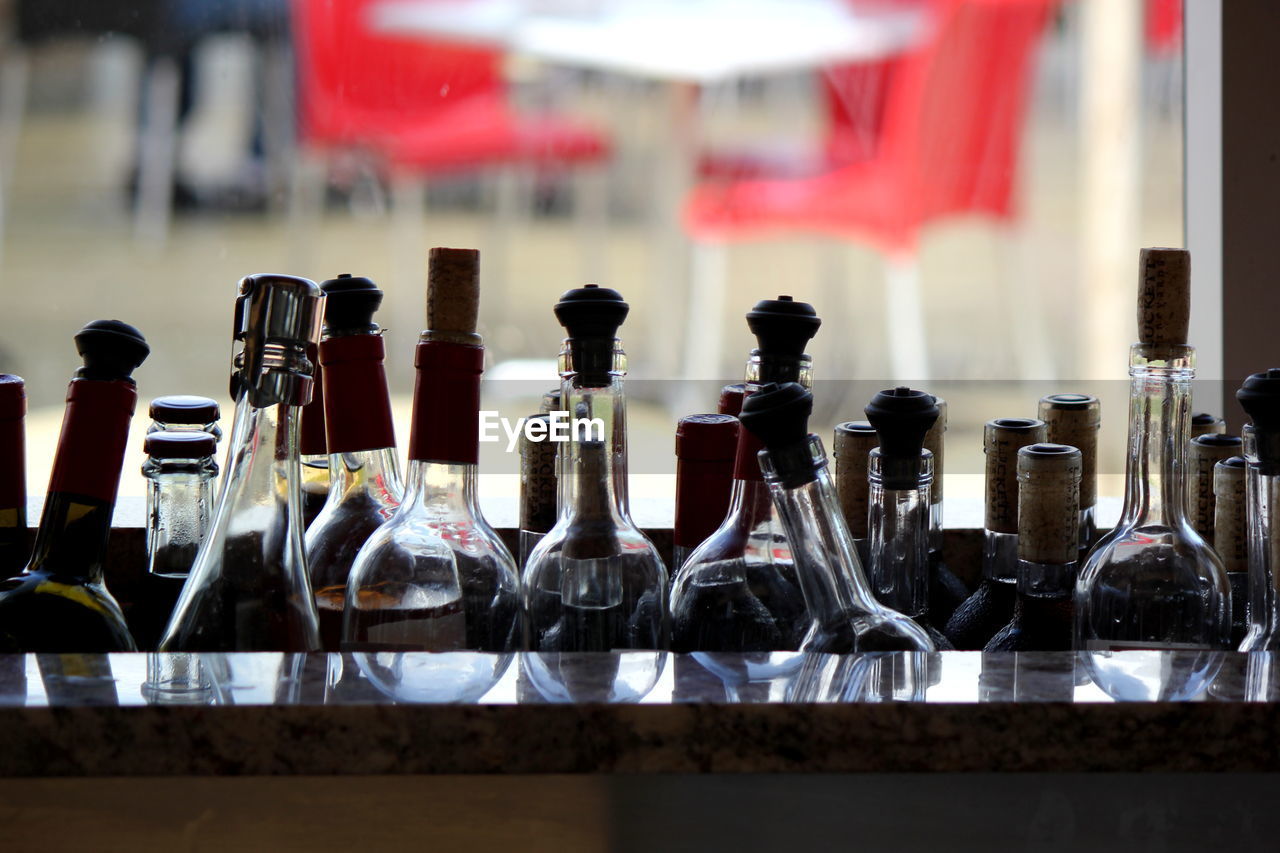 Glass bottles against window