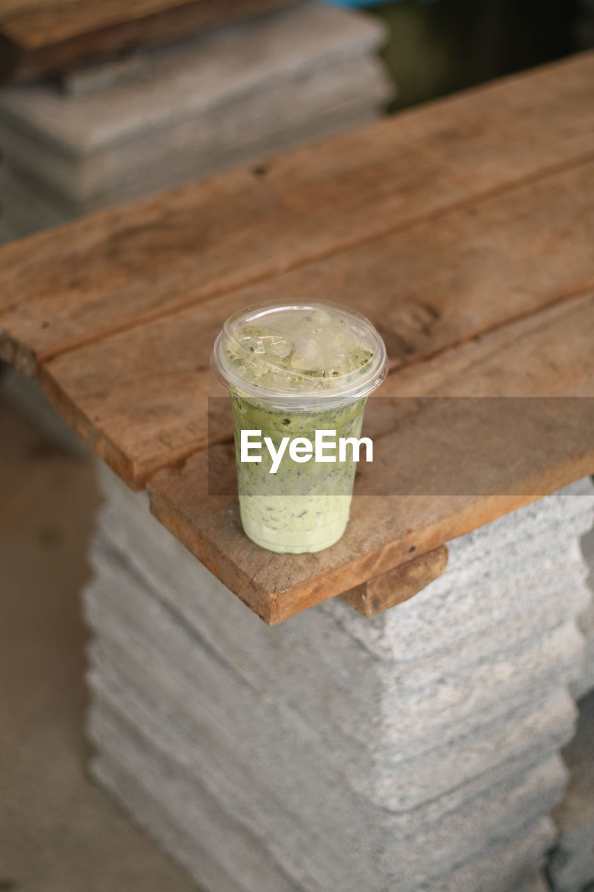 food and drink, drink, refreshment, wood, food, household equipment, freshness, healthy eating, drinking glass, wellbeing, glass, no people, focus on foreground, close-up, still life, fruit, indoors, lighting, high angle view, table, cold temperature, soft drink, day