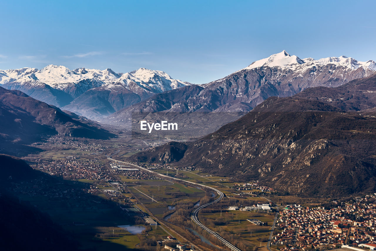 Aerial view of snowcapped mountains against sky