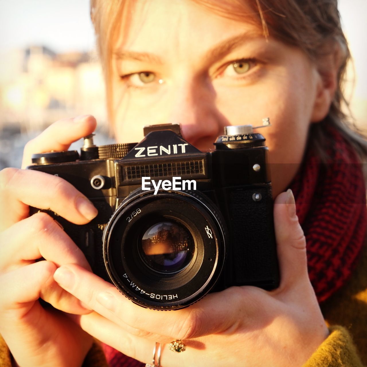 PORTRAIT OF MAN HOLDING CAMERA