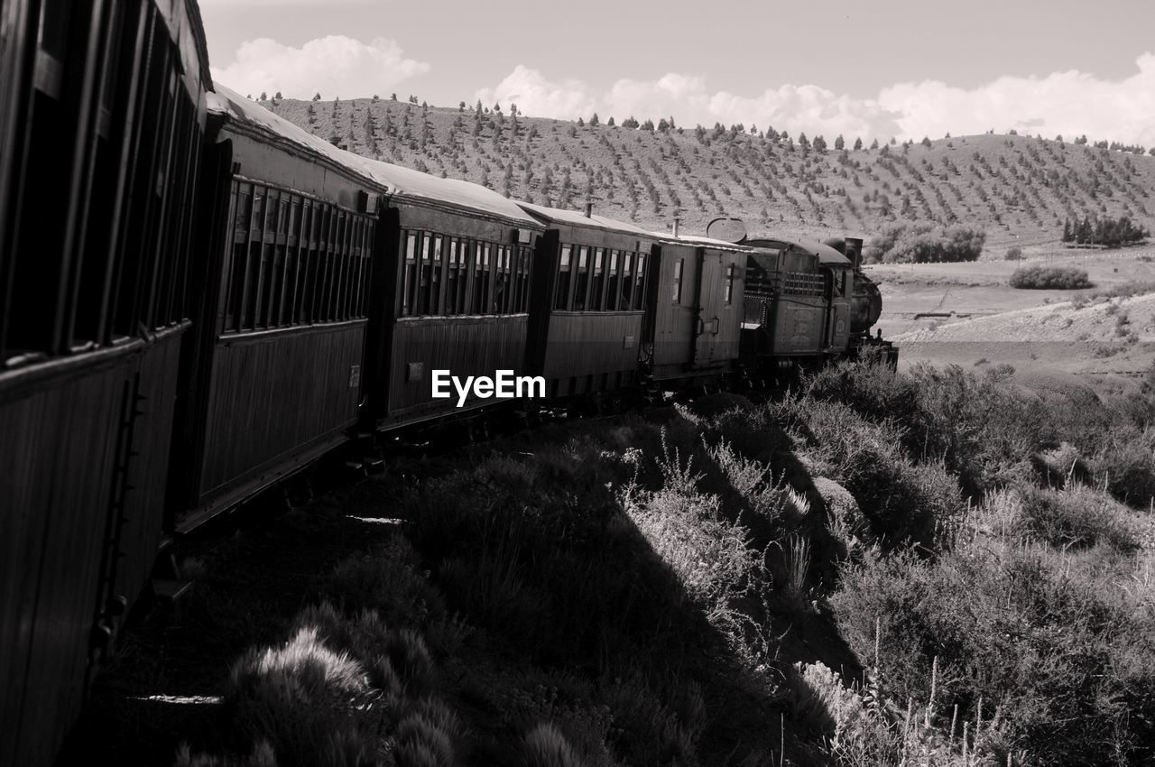 Train on railroad track against sky