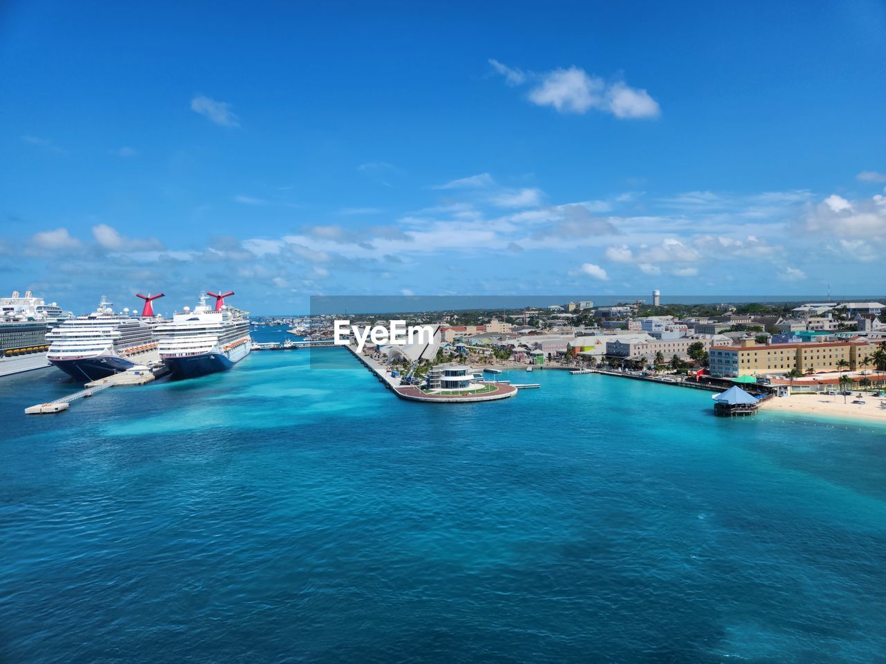 water, sea, transportation, nautical vessel, mode of transportation, sky, architecture, nature, blue, travel destinations, travel, city, harbor, ocean, vehicle, coast, land, ship, building exterior, cloud, vacation, bay, built structure, day, marina, beach, outdoors, tourism, no people, holiday, scenics - nature, trip, luxury, yacht, beauty in nature, building, craft, pier, waterfront, moored, port, high angle view, wealth, passenger ship, sunlight