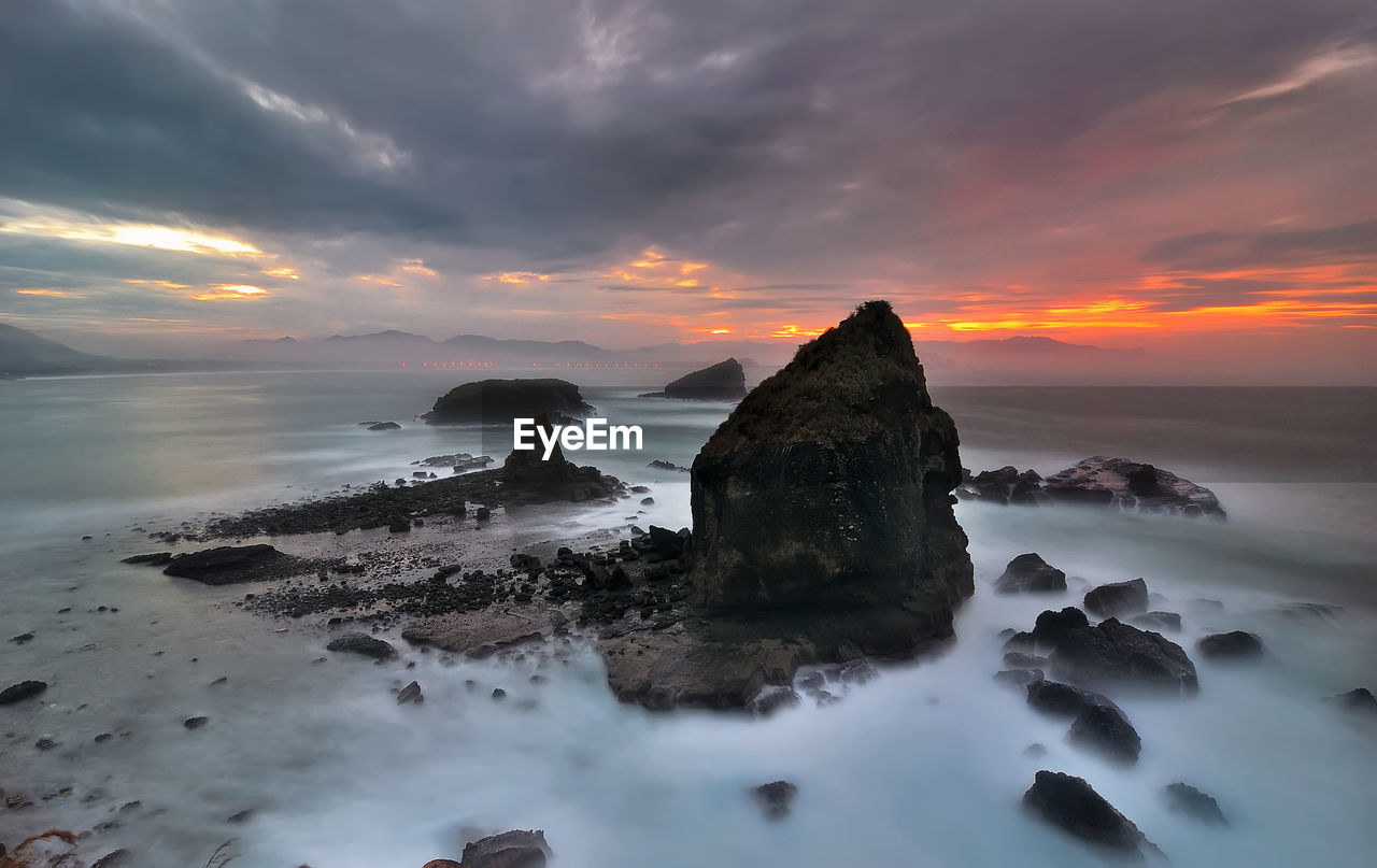 Scenic view of sea against sky during sunset