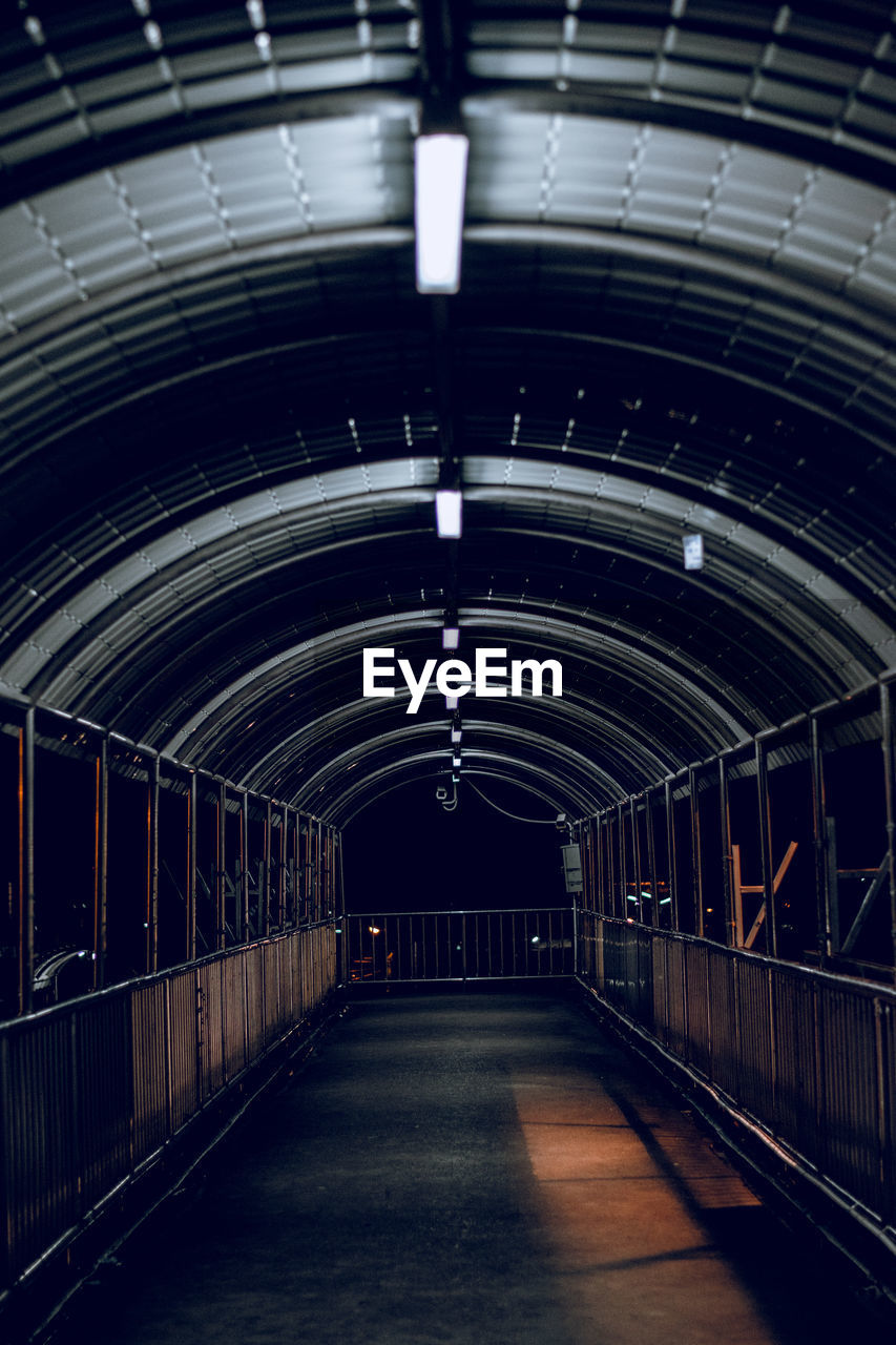 Illuminated empty subway tunnel