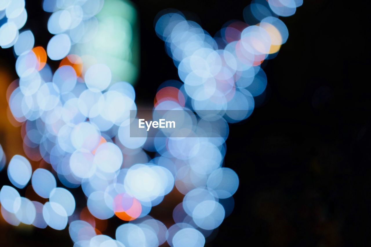 Defocused image of illuminated lights at night