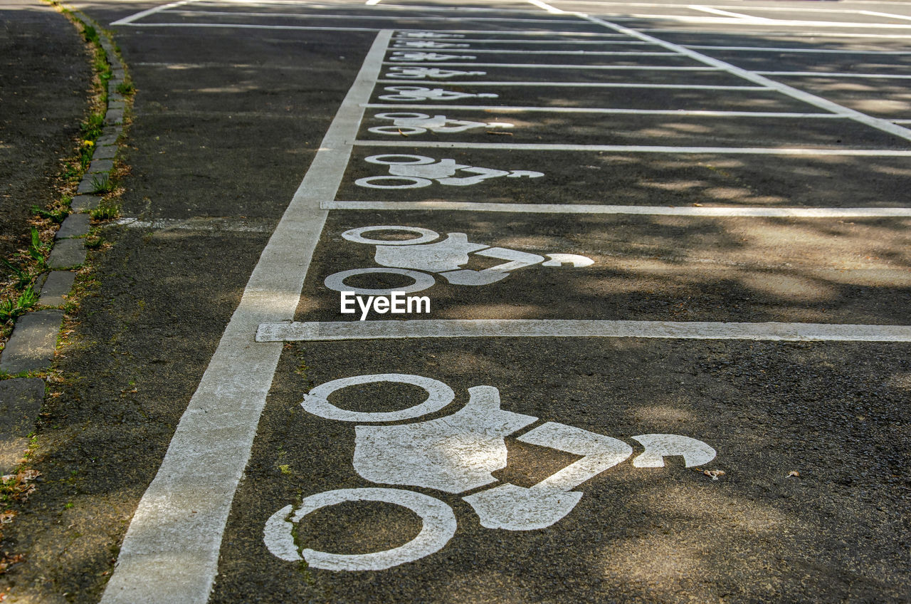 Parking spaces for motorbikes on a parking lot near the crater lakes