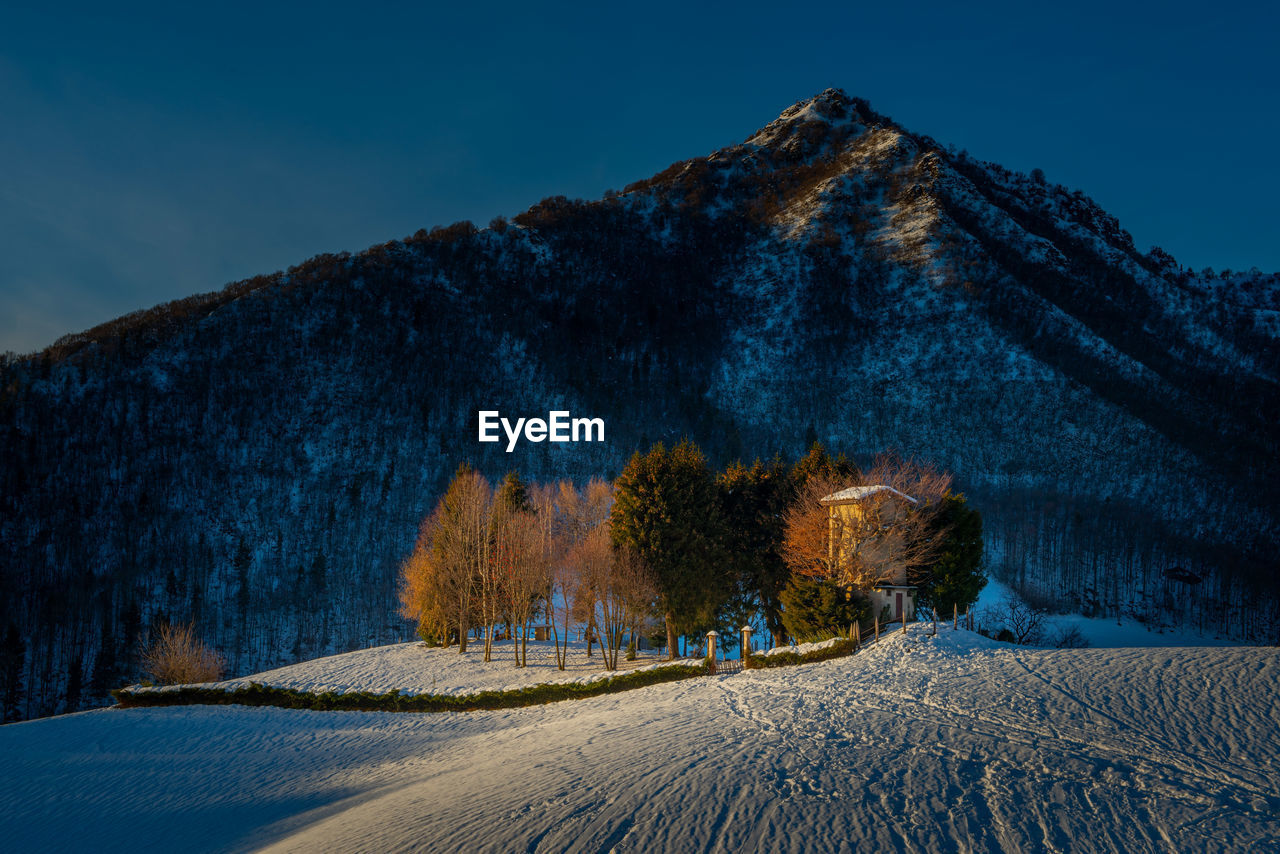 Isolated cottage in the snow