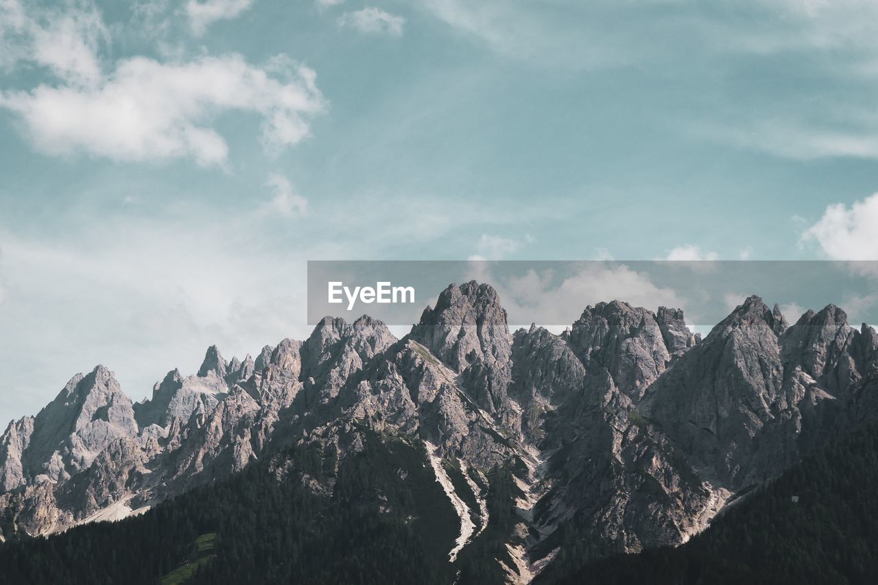 Panoramic view of mountain range against sky