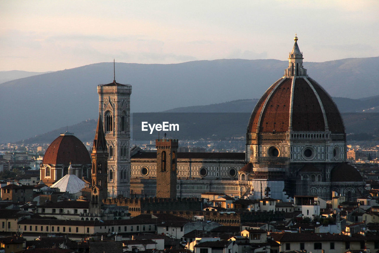 View of cathedral and cityscape against sky