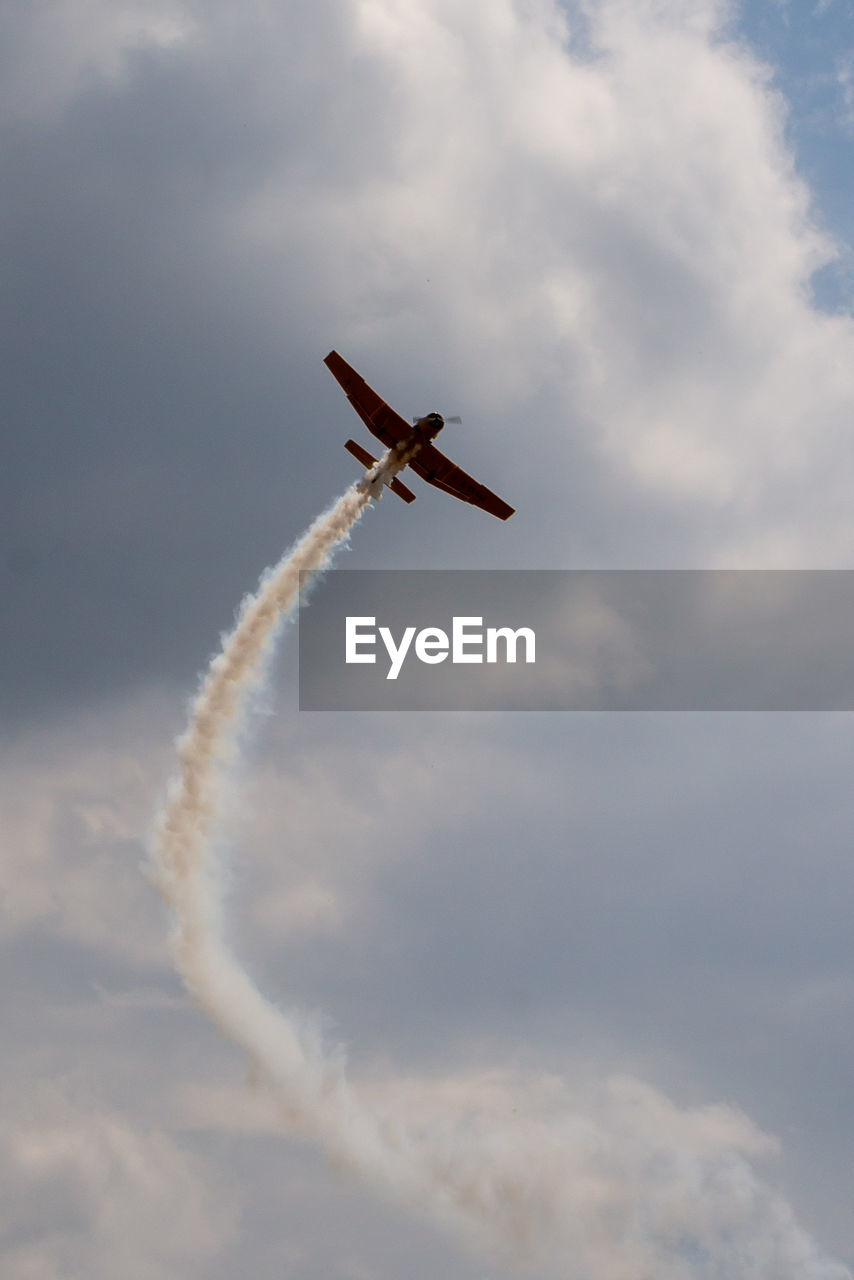 Low angle view of airplane flying in sky