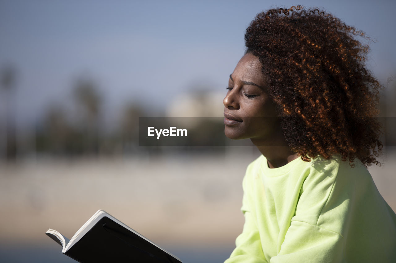 portrait of young woman using mobile phone