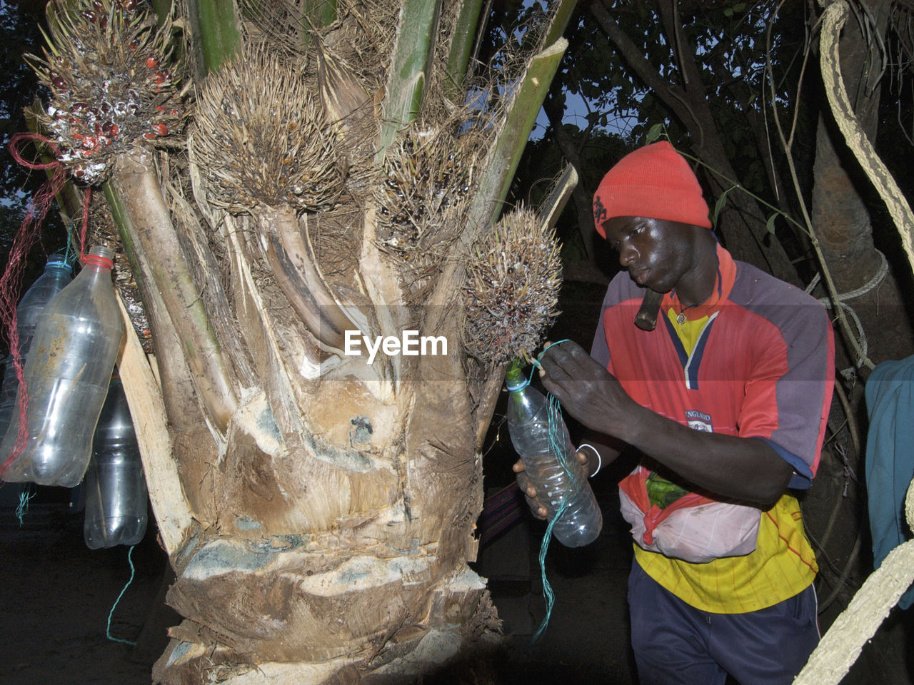 MIDSECTION OF MAN WORKING ON DISPLAY