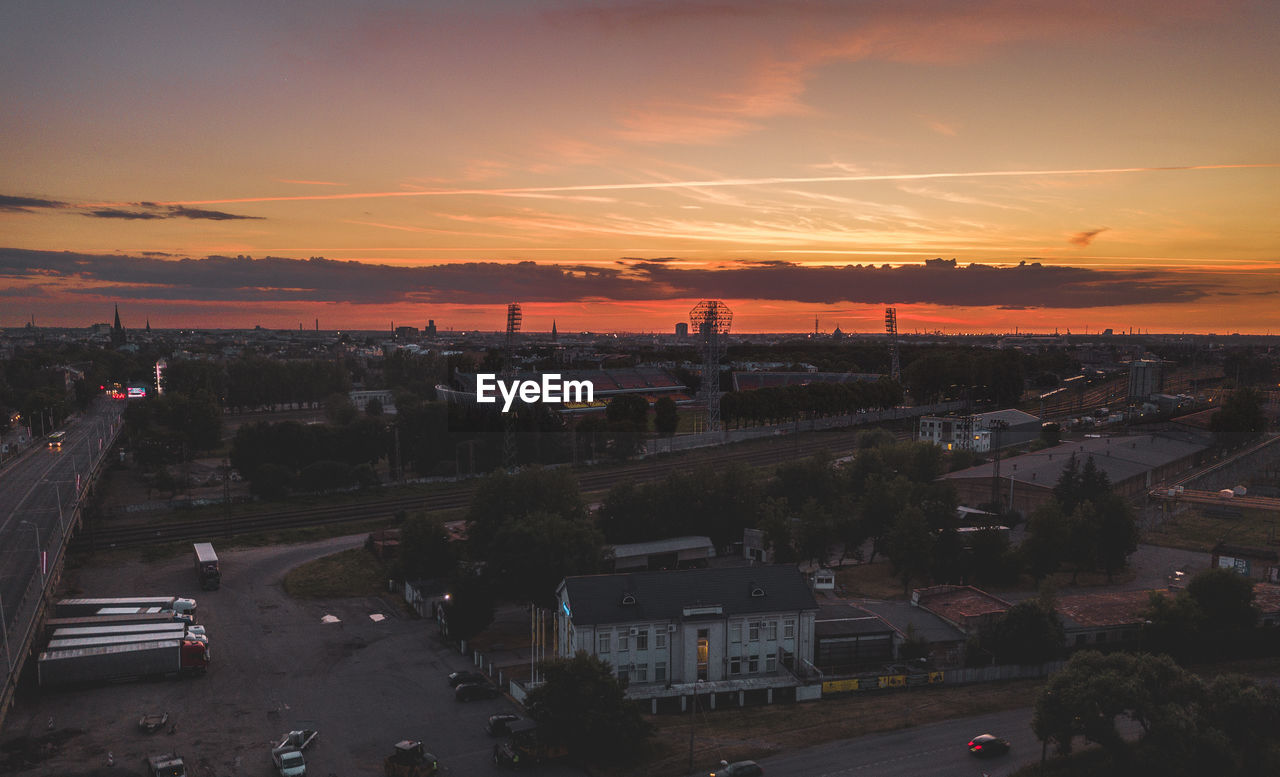 High angle view of city against sky during sunset