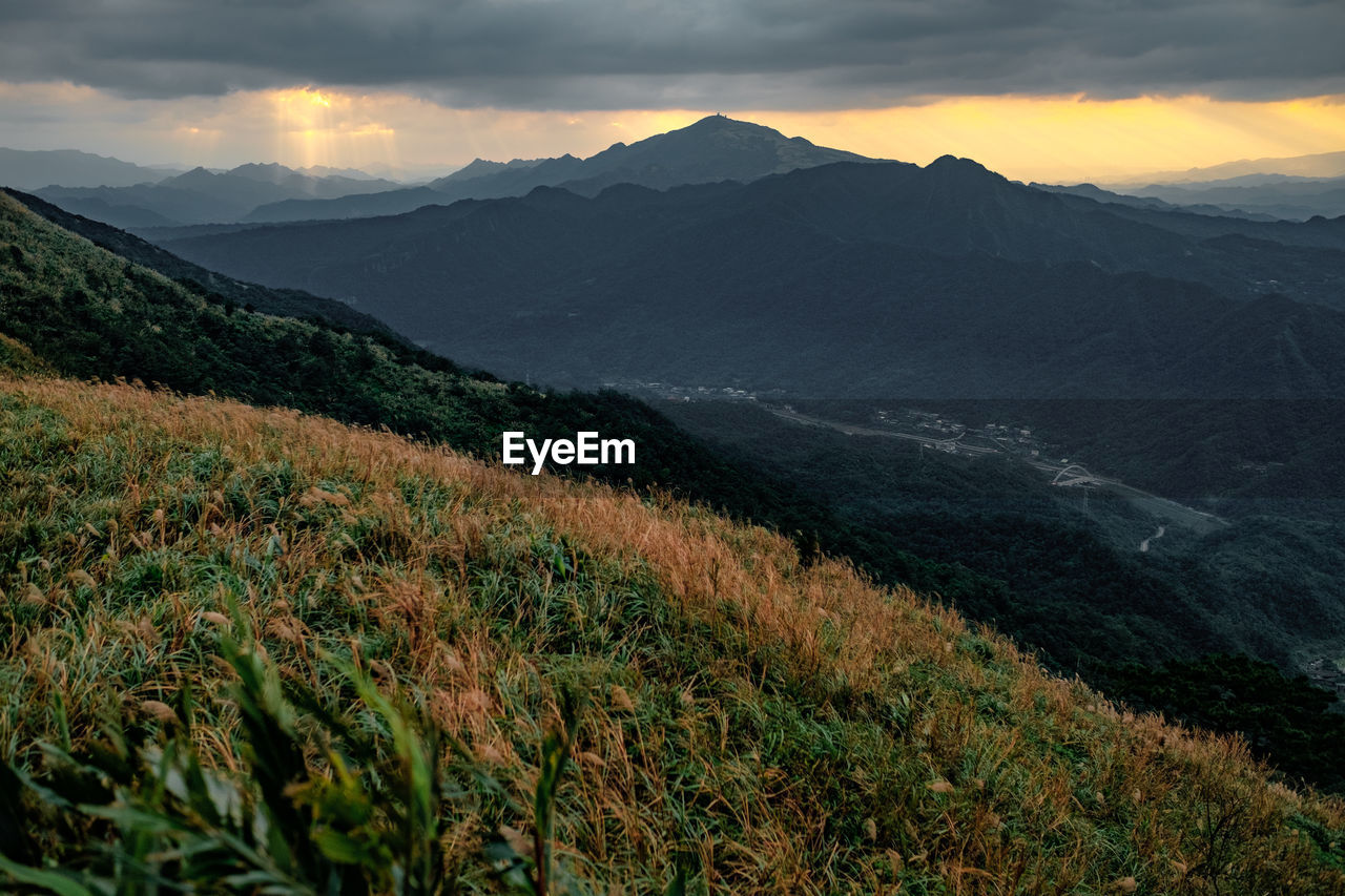 Scenic view of mountains against sky during sunset