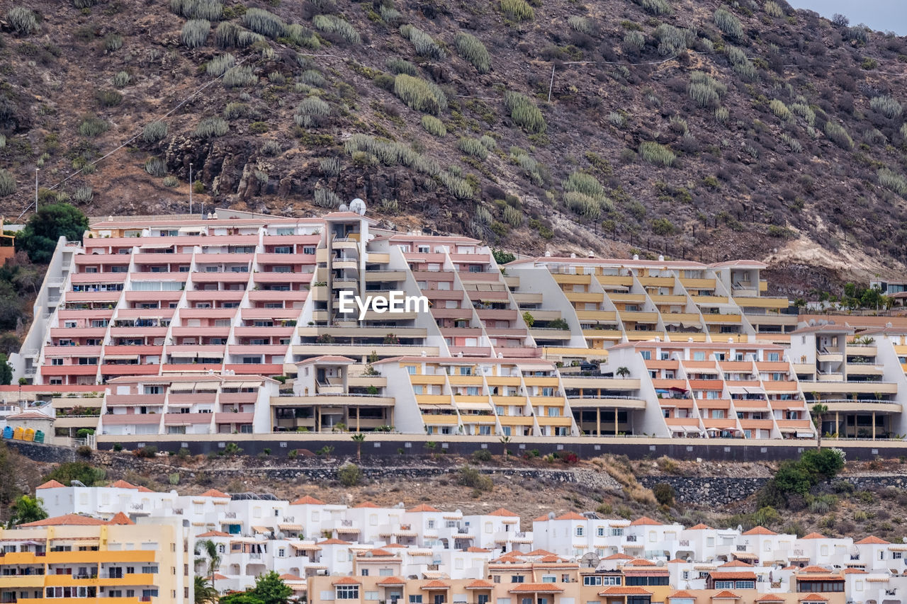 Aerial view at hillside full of vacation homes close together at canary island