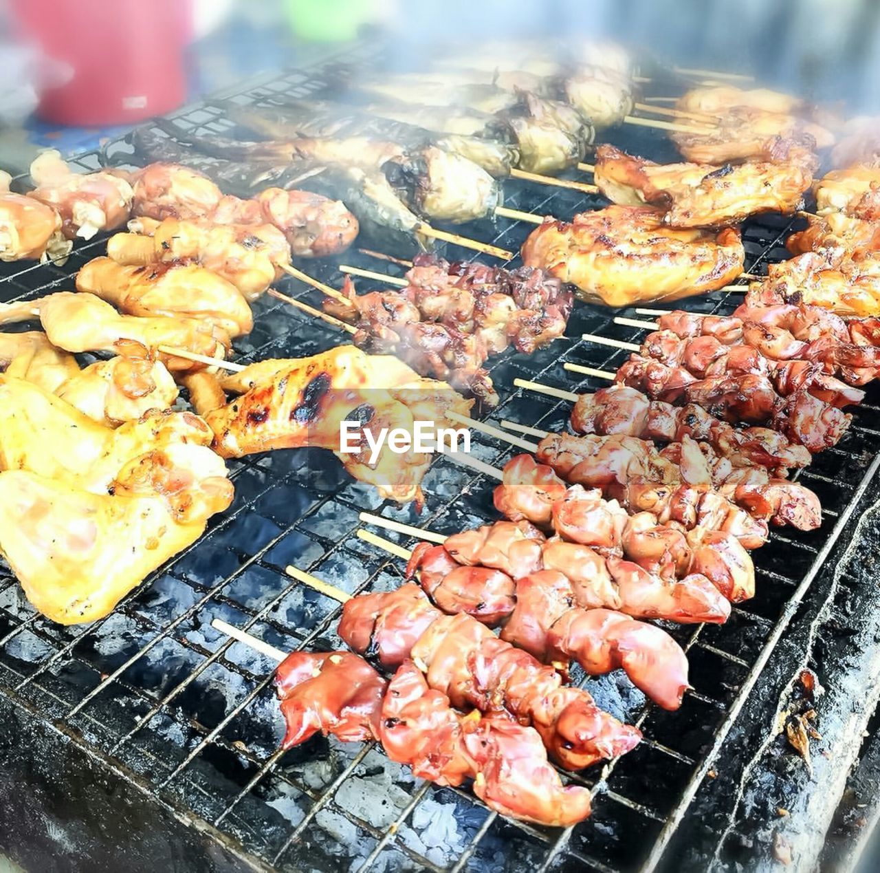 CLOSE-UP OF MEAT ON BARBECUE