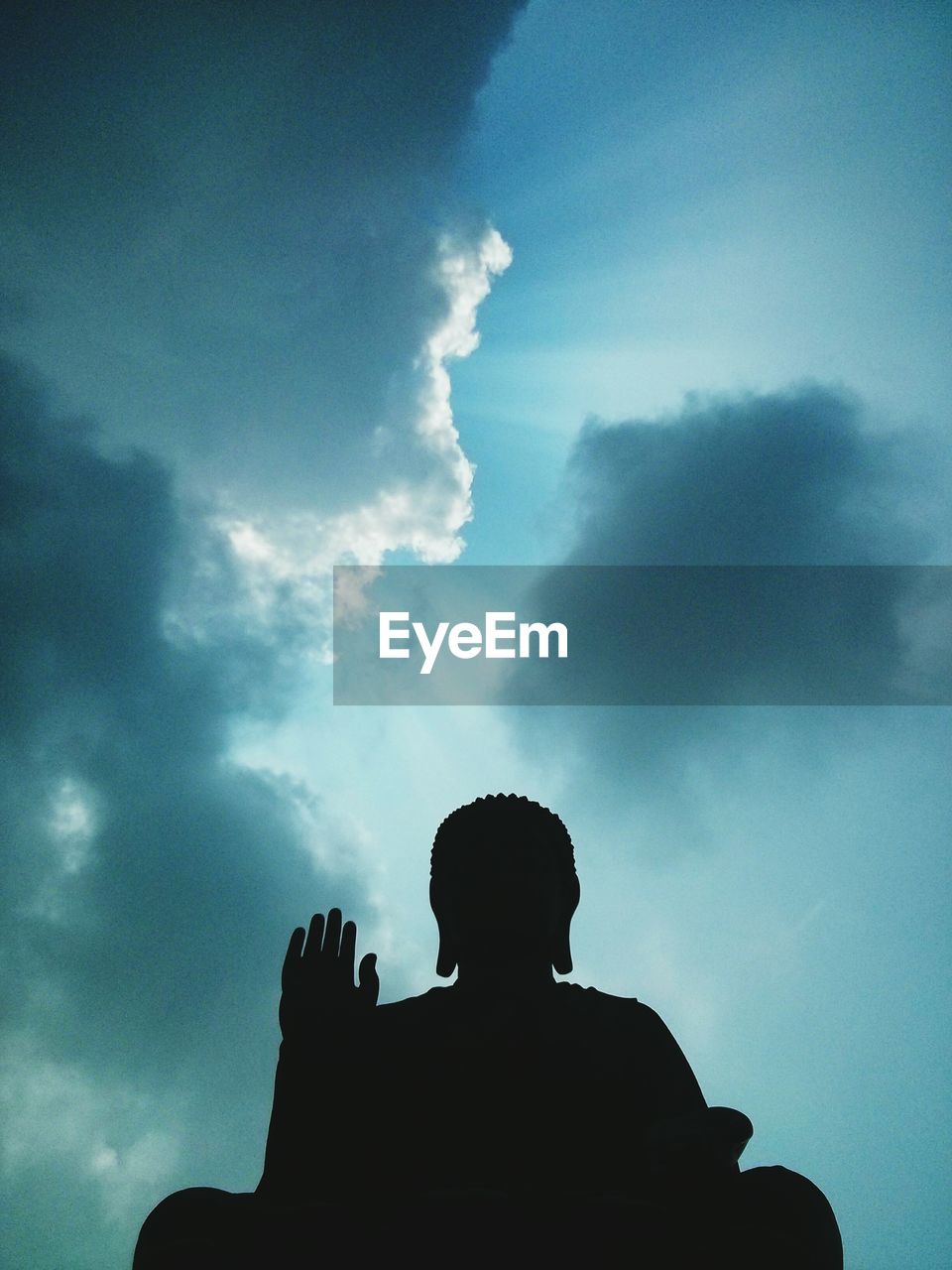 Silhouette of buddha statue