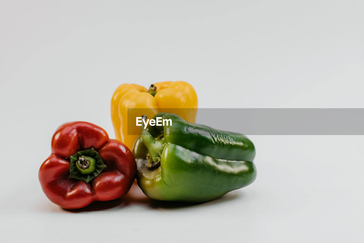 Close-up of bell peppers against white background