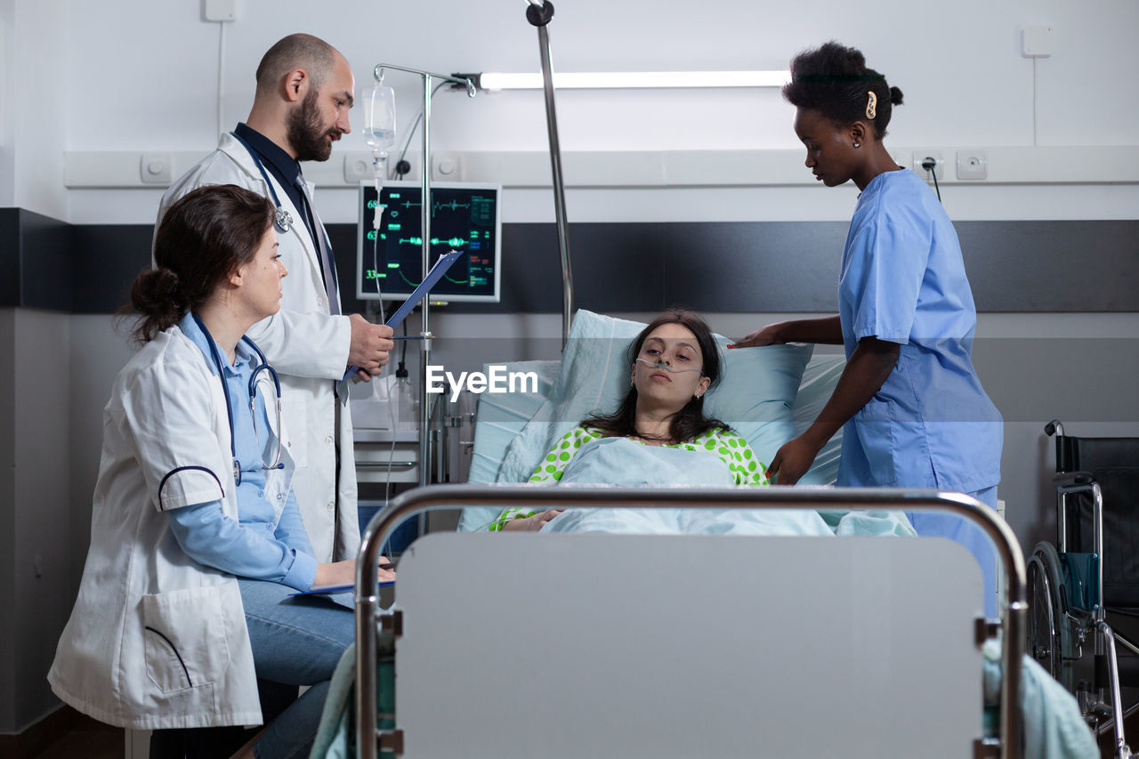 Side view of female doctor working in hospital