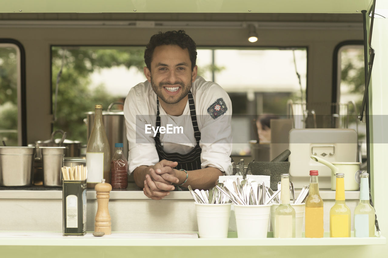 Portrait of smiling man in a food truck