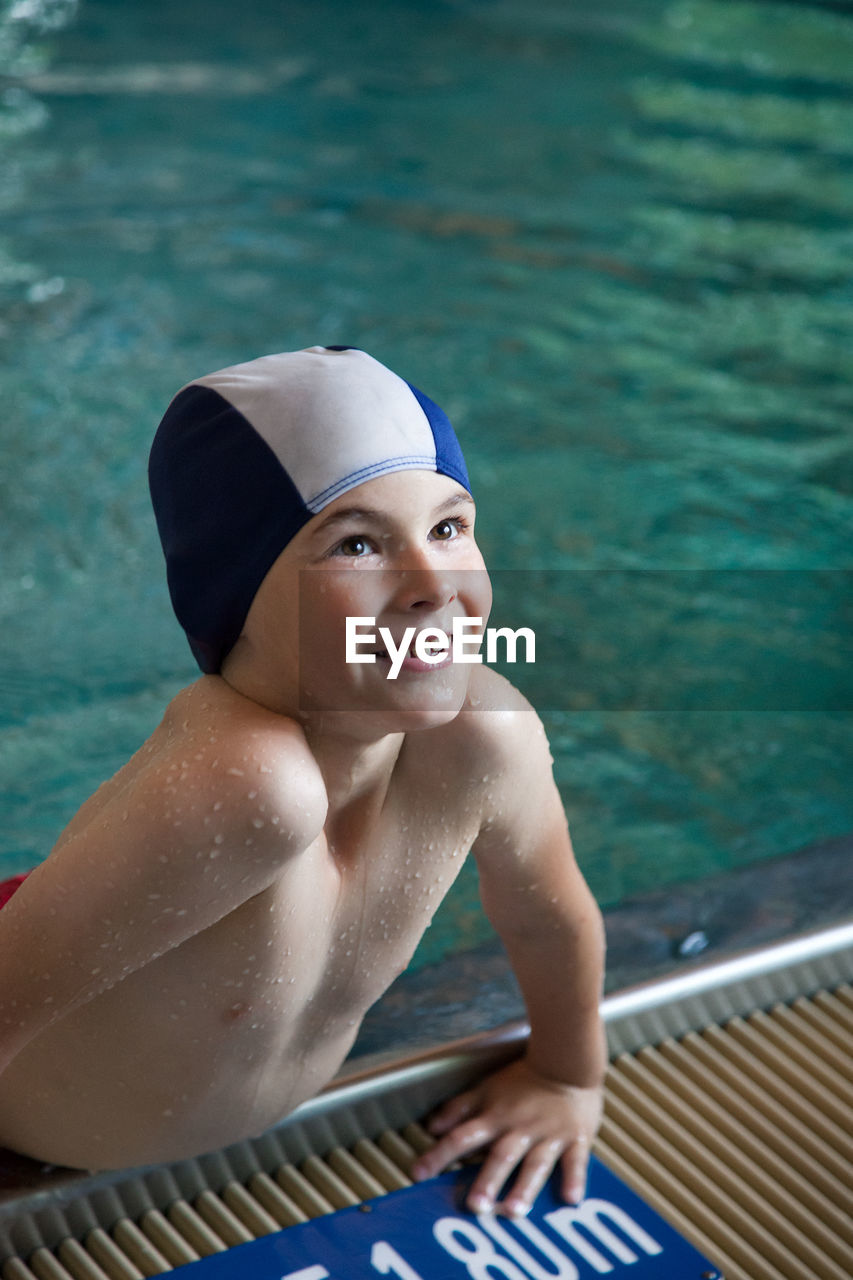 Portrait of happy boy in swimming pool