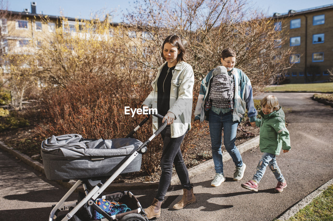 Women having walk with children