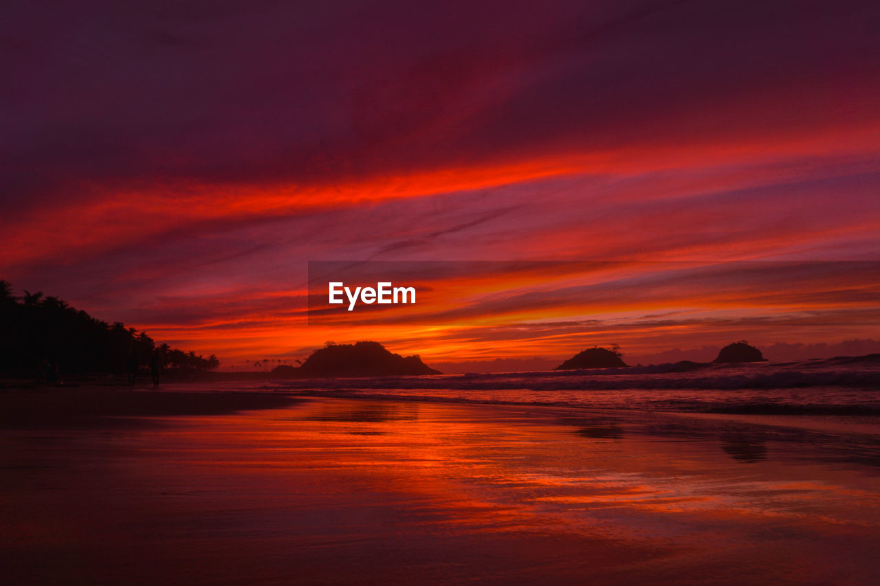 Reflection of sunset by the beach