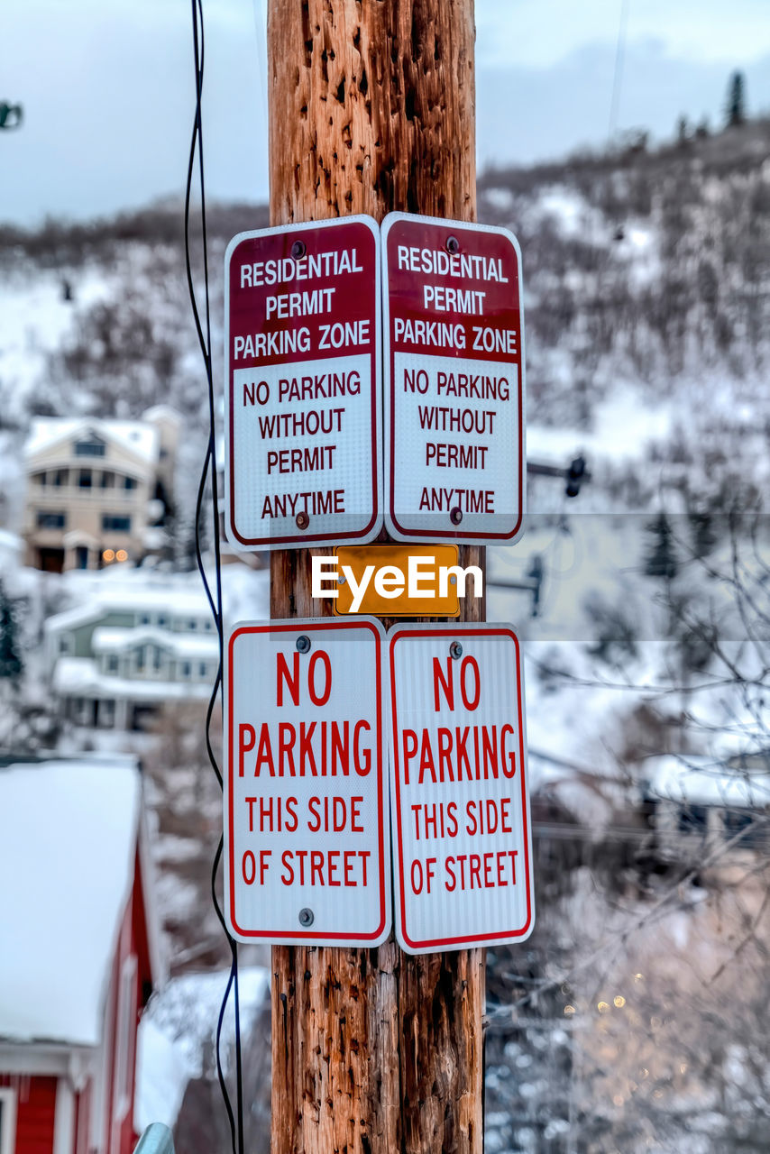 WARNING SIGN ON SNOW COVERED LAND