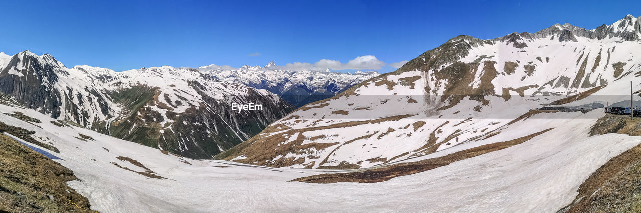 Ultra wide panorama from the nufenenpass with snowy mountains