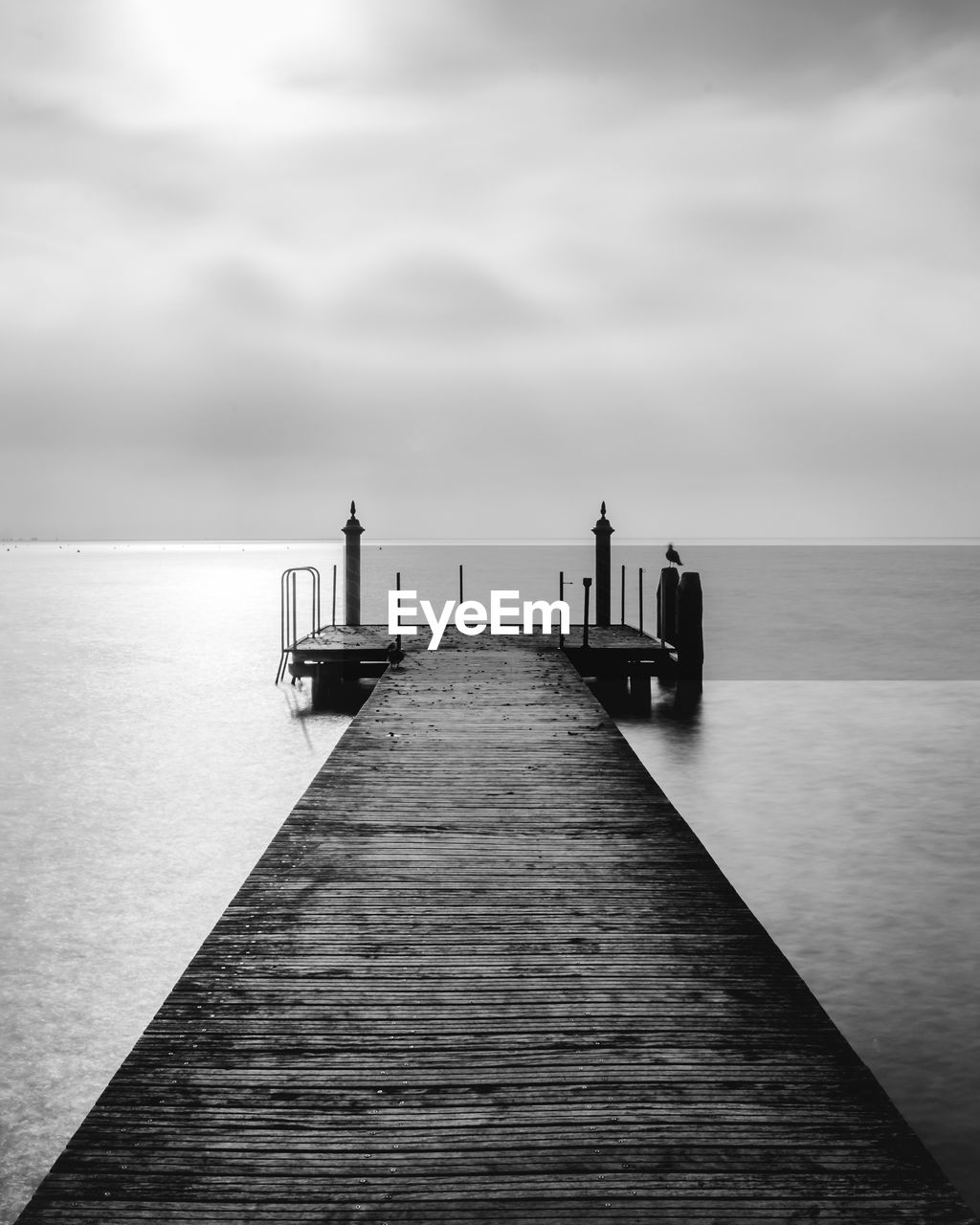 Pier over sea against sky