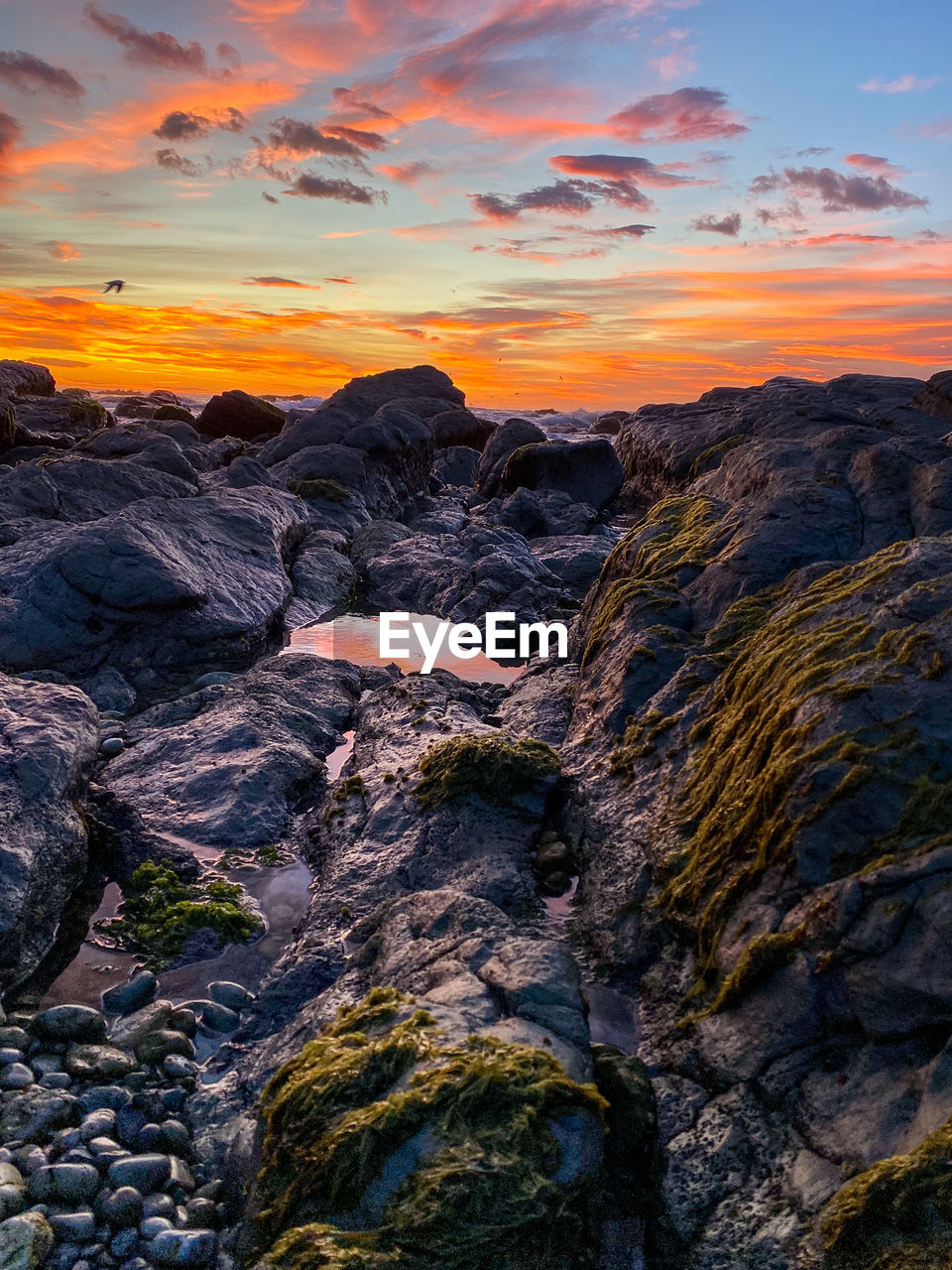 ROCK FORMATIONS AGAINST SKY DURING SUNSET